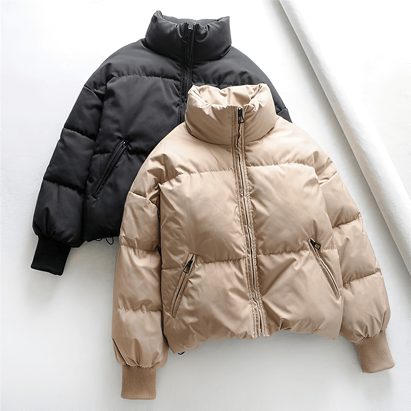Elegant fashion ladies stand collar parka with zipper pockets. Cozy winter down jacket in beige and black, perfect for stylish warmth.